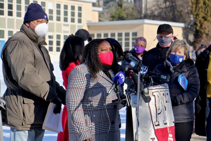 City Councilmember Kendra Brooks stands with teachers protesting the district's reopening plan