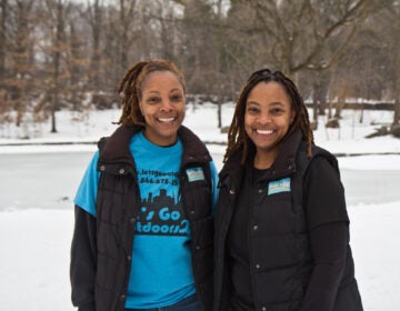 Tarsha and Keisha Scovens at the pond at Awbury Arboretum in Philadelphia near the Wingohocking Creek. (Kimberly Paynter/WHYY)