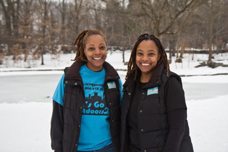 Tarsha and Keisha Scovens at the pond at Awbury Arboretum in Philadelphia near the Wingohocking Creek. (Kimberly Paynter/WHYY)