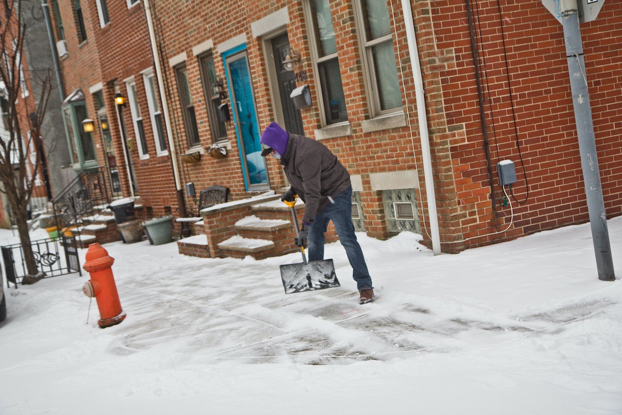 People in Fishtown shovel outside their homes