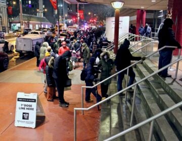 Philadelphians wait in line outside the Liacouras Center at Temple University, where the Black Doctors COVID-19 Consortium was holding a 24-hour vaccination clinic. (Emma Lee/WHYY)