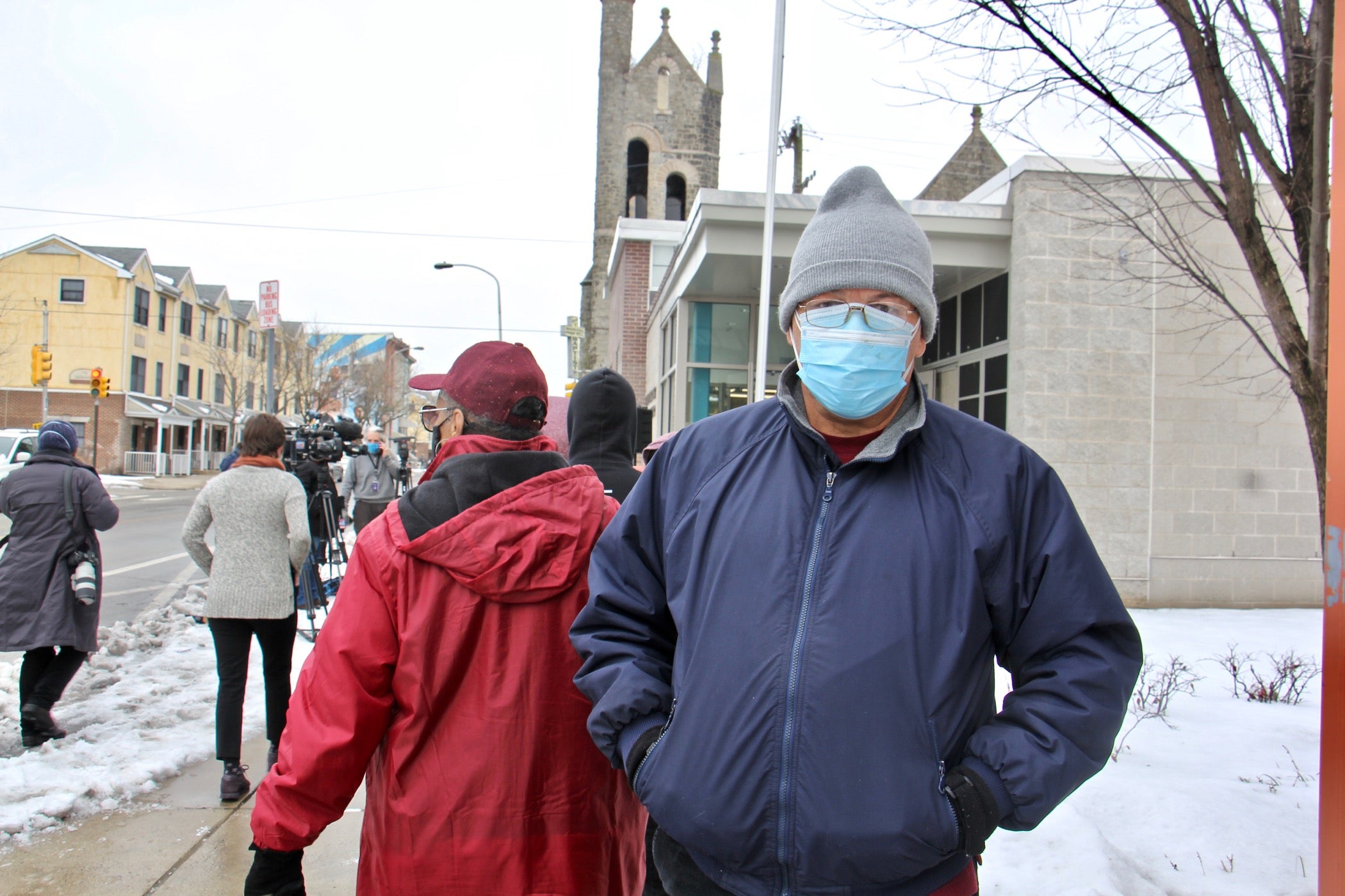 Hector Martinez waits in line to receive a COVID-19 vaccine