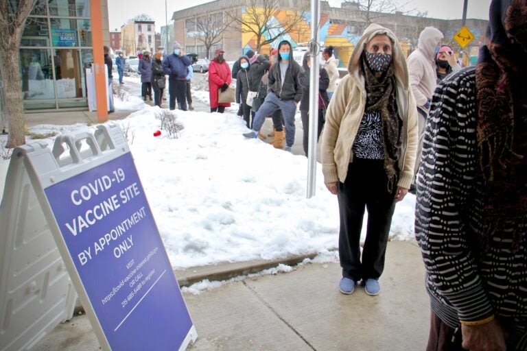 People with appointments wait in line at Philadelphia's first standing city-run COVID-19 vaccination clinic, which opened at the Martin Luther King Jr. Older Adult Center on Cecil B. Moore Avenue, Tuesday, Feb. 23, 2021. (Emma Lee/WHYY)