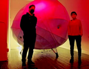 Severino Alfonso (left) and Loukia Tsafoulio are the creators of Synesthesia, a work of art exploring the interface between humans and machines, on exhibit at HOT*BED gallery in Old City. (Emma Lee/WHYY)