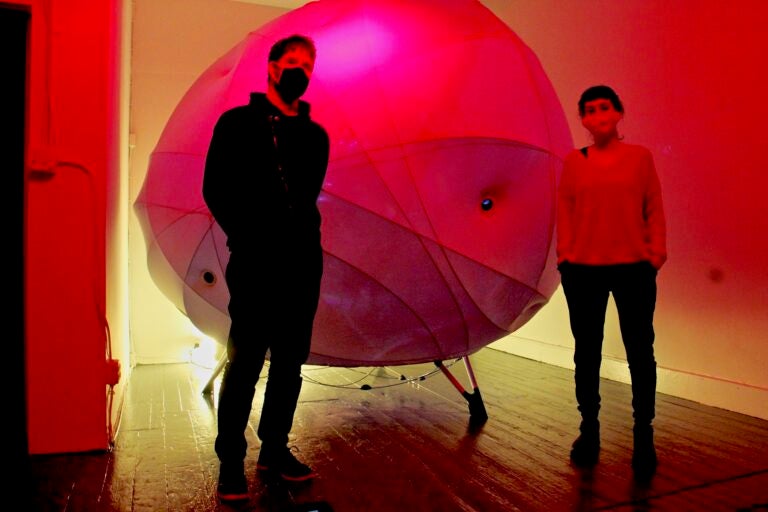 Severino Alfonso (left) and Loukia Tsafoulio are the creators of Synesthesia, a work of art exploring the interface between humans and machines, on exhibit at HOT*BED gallery in Old City. (Emma Lee/WHYY)