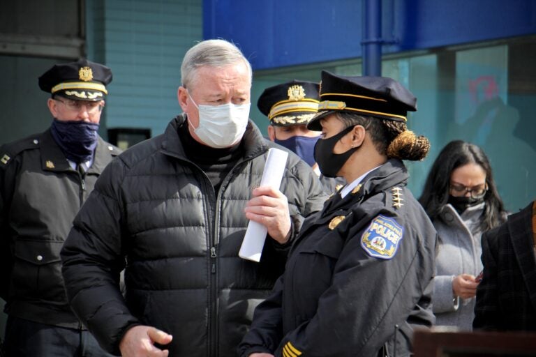 Philadelphia Mayor Jim Kenney and Police Commissioner Danielle Outlaw confer during a press event at Olney Transportation Center, where a mass shooting occurred on Feb. 17, 2021. (Emma Lee/WHYY)