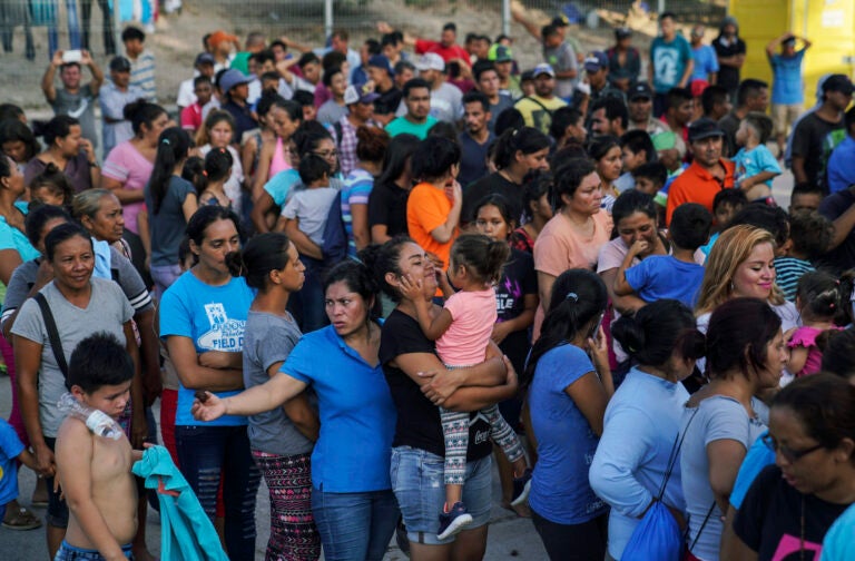 In this Aug. 30, 2019, file photo, migrants, many of whom were returned to Mexico under the Trump administration's 