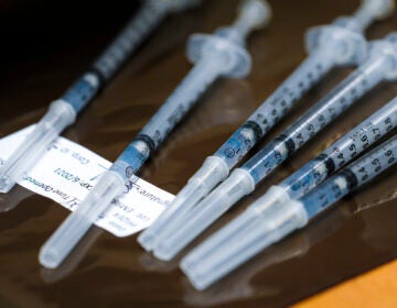 COVID vaccine in syringes ready for inoculations. (Nelvin C. Cepeda/The San Diego Union-Tribune via AP, Pool)