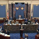 In this image from video, Michael van der Veen, an attorney for former President Donald Trump, listens as the clerk read a question from Sen. Bill Cassidy, R-La., during the second impeachment trial of former President Donald Trump in the Senate at the U.S. Capitol in Washington, Friday, Feb. 12, 2021. (Senate Television via AP)