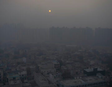 In this Saturday, Jan. 2, 2021 file photo, the morning sun is seen through a blanket of smog on the outskirts of New Delhi, India. (AP Photo/Altaf Qadri)