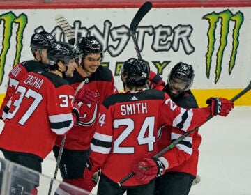 New Jersey Devils celebrate with center Pavel Zacha (37) after he scored a goal