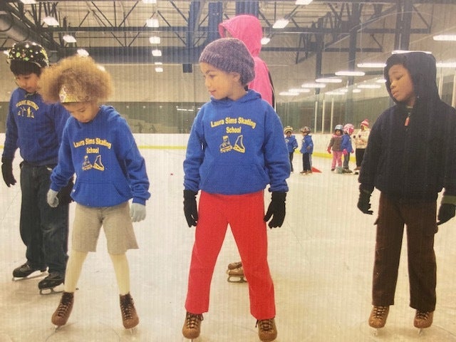 Pictures of instructors and children at Laura Sims Skate House in Cobbs Creek are hung on the walls throughout the rink. (Taylor Allen/WHYY)