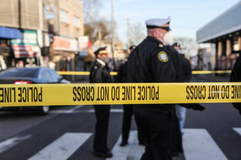 Police tape marks off a crime scene near Olney Transportation Center