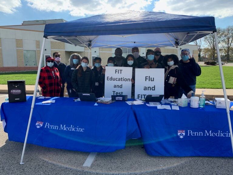 Dr. Carmen Guerra and colleagues partnered with Einstein Medical Center and the Rev. Leroy Miles of Enon Tabernacle Church in Philadelphia to establish a socially distant drive-by FluFIT clinic to simultaneously administer flu vaccines and fecal immunochemical tests for colorectal cancer screening. (Courtesy of Carmen Guerra)