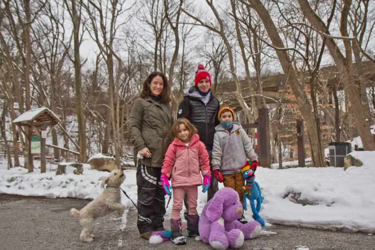 Rachael and Phil Reilly with their children Winnie, 6, and Caden, 8, and dog Rosie, before taking a walk along the Wissahickon Creek in Philadelphia, Pa. (Kimberly Paynter/WHYY)