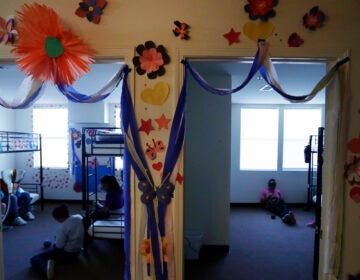 The Biden administration has reopened shelters for migrant teens that were first used by the Trump administration in Carrizo Springs, Texas. Long trailers that previously housed oil workers in two-bedroom suites were turned into dorms with bunk beds, classrooms and medical care. (Eric Gay/AP Photo)