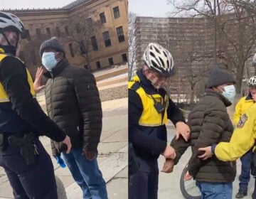 A swarm of Philadelphia police officers arrest a man they accused of soliciting money in return for photos outside the Philadelphia Museum of Art. (Claire Wolters)