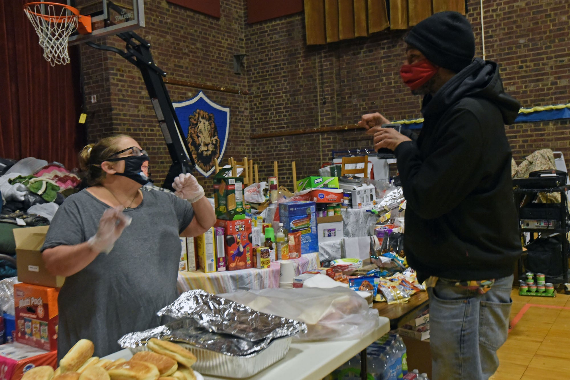 Jennifer Conrad helps serve dinner