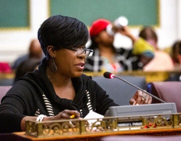 Councilmember Cherelle Parker sits at a desk