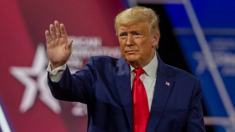 Then-President Donald Trump waves at the crowd during the 2020 Conservative Political Action Conference. This year, Trump is out of office but is still headlining the event. (Tasos Katopodis/Getty Images)
