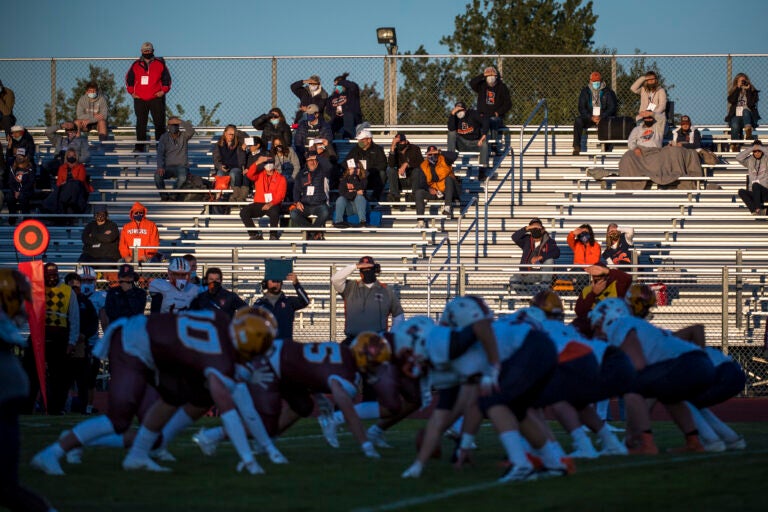 Fans watch the high school football game between Davison and Flint Powers Catholic on September 18, 2020 in Davison, Michigan.