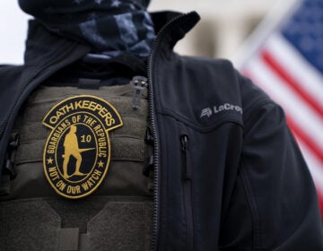 A demonstrator wears an Oath Keepers anti-government organization badge on a tactical vest during a protest outside the Supreme Court in Washington, D.C., on Jan. 5, 2021. (Stefani Reynolds/Bloomberg via Getty Images)