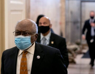 James Clyburn (D-SC) (L) wears a protective mask while arriving to the U.S. Capitol