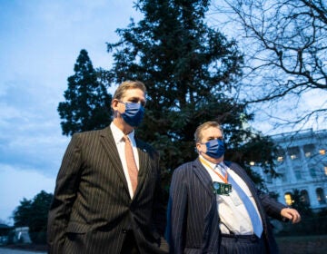 Bruce Castor (left), defense attorney for former President Donald Trump, departs the Capitol following the first day of the impeachment trial. Sarah Silbiger/Getty Images