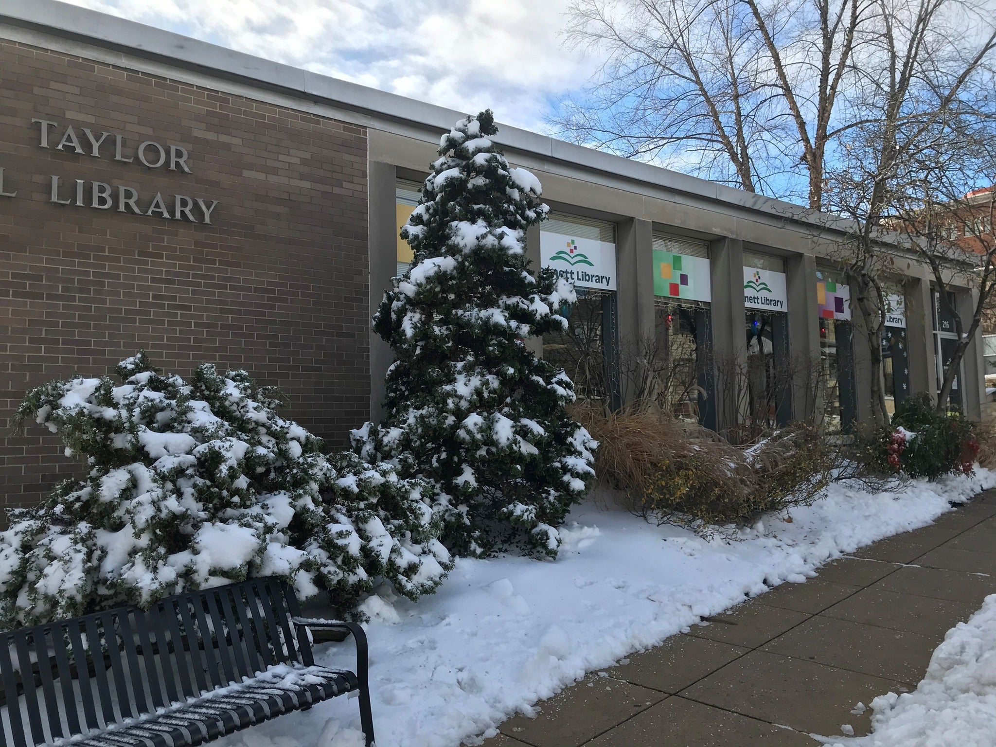 The exterior of Kennett Library. surrounded by snow