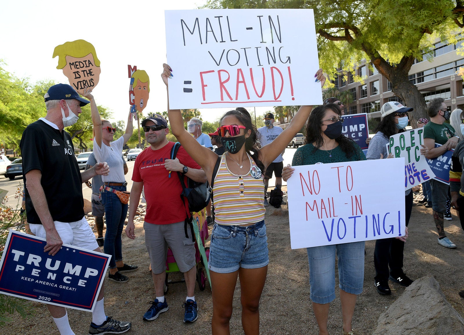 Trump supporters protest against the passage of a mail-in voting bill