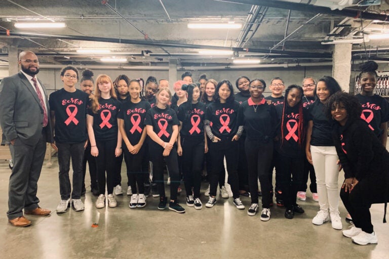 Aaron Taylor (far left) at the Erie Otters Hockey Club in Erie, PA after his students performed the National Anthem. (Courtesy of Aaron Taylor)