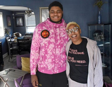 Ta'Quan Woodley poses for a photo with Tracey Hall, who invited him to live in her Camden home in February of 2020. She said he has been 