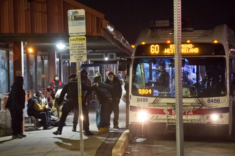 Transit police forcibly remover a violent passenger from a SEPTA bus in Upper Darby, Pa., around 1 a.m. on March 4, 2021. (Kimberly Paynter/WHYY)
