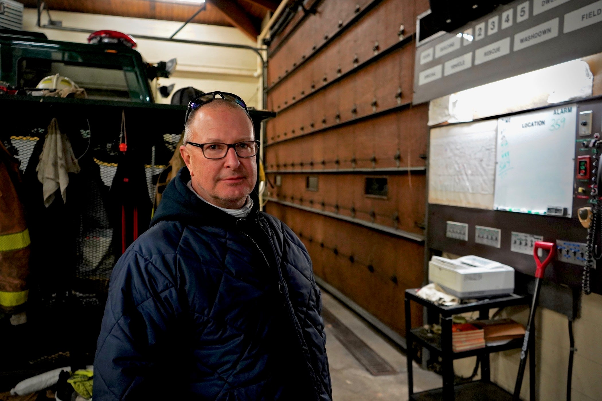 Thomas Prociuk stands inside a fire station