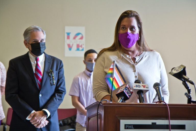 Deja Lynn Alvarez speaks at a podium