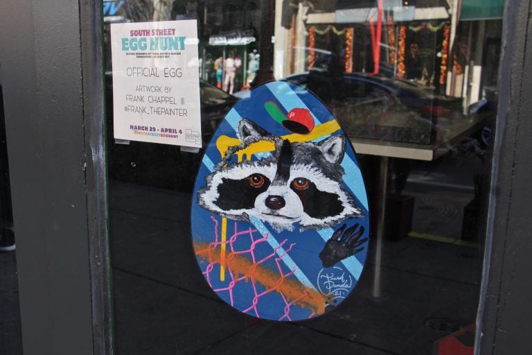 A decorated Easter Egg hanging in a window on South Street in Philadelphia