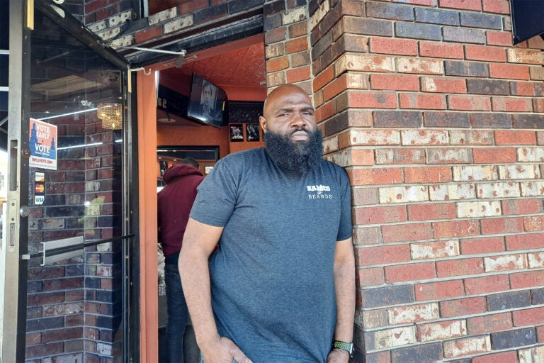Faheem Alexander, owner of Faheem’s Hands of Precision Barber Shop, said he and his staff try and set good examples for young people. But to fight gun violence it's going to take others to pitch in. (Ximena Conde / WHYY)