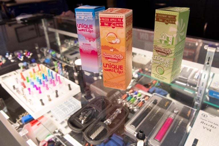 This Jan. 2, 2020, file photo shows flavored vaping liquids and devices on display at the VapeNY.com store in New York. (AP Photo/Mary Altaffer)
