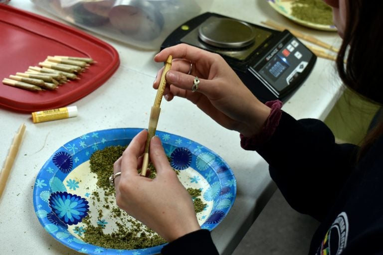 Maesa Story, a worker at Montana Advanced Caregivers, packs a joint with marijuana at the Billings, Mont. medical marijuana dispensary on Nov. 11, 2020. Recreational marijuana initiatives passed in four states this year, from liberal New Jersey to conservative Montana and South Dakota. The results prove how broadly accepted marijuana has become throughout the country and across party lines. (AP Photo/Matthew Brown)