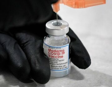 University of Pittsburgh Pharmacy student Edith Wang loads a syringe with a dose of the Moderna Covid-19 Vaccine, during a vaccination clinic hosted by the University of Pittsburgh and the Allegheny County Health Department at the Petersen Events Center, in Pittsburgh, Thursday, Jan. 28, 2021. (AP Photo/Gene J. Puskar)