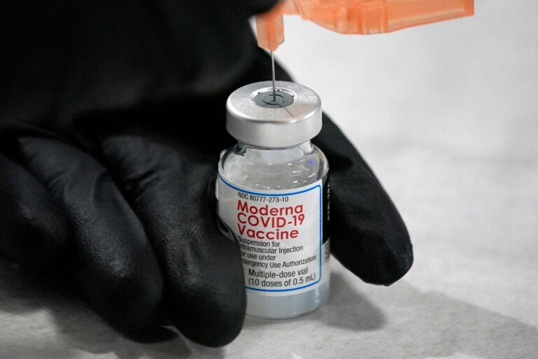 University of Pittsburgh Pharmacy student Edith Wang loads a syringe with a dose of the Moderna Covid-19 Vaccine, during a vaccination clinic hosted by the University of Pittsburgh and the Allegheny County Health Department at the Petersen Events Center, in Pittsburgh, Thursday, Jan. 28, 2021. (AP Photo/Gene J. Puskar)