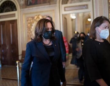 Vice President Kamala Harris arrives to break the tie on a procedural vote as the Senate works on the Democrats' $1.9 trillion COVID relief package, on Capitol Hill in Washington, Thursday, March 4, 2021. (AP Photo/J. Scott Applewhite)