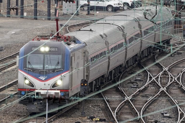 An Amtrak train departs 30th Street Station in Philadelphia, Wednesday, March 31, 2021.