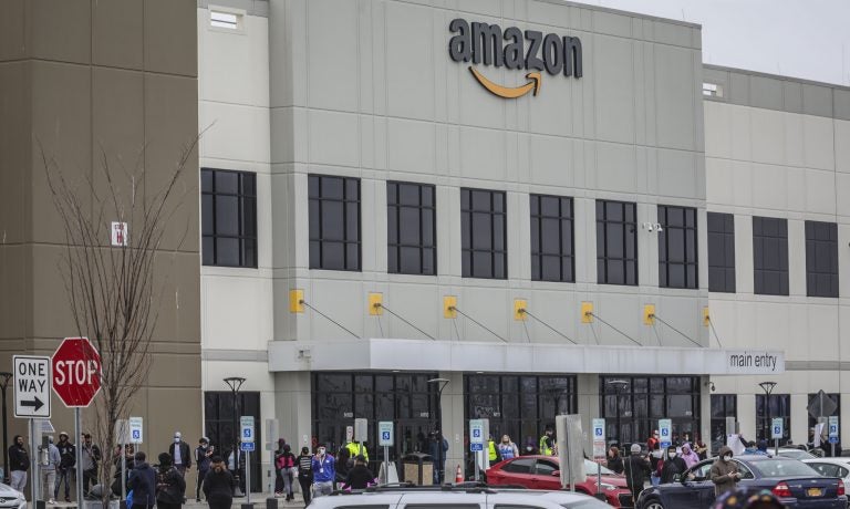 Workers at Amazon's fulfillment center in Staten Island, N.Y., gather outside to protest work condition