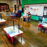 Tara Matise teaches her prekindergarten students virtually in her classroom