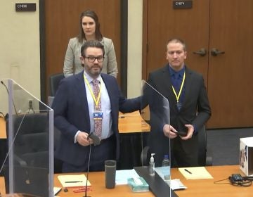 Defense attorney Eric Nelson, left, defendant and former Minneapolis police officer Derek Chauvin, right, and Nelson's assistant Amy Voss, back, introduce themselves to potential jurors