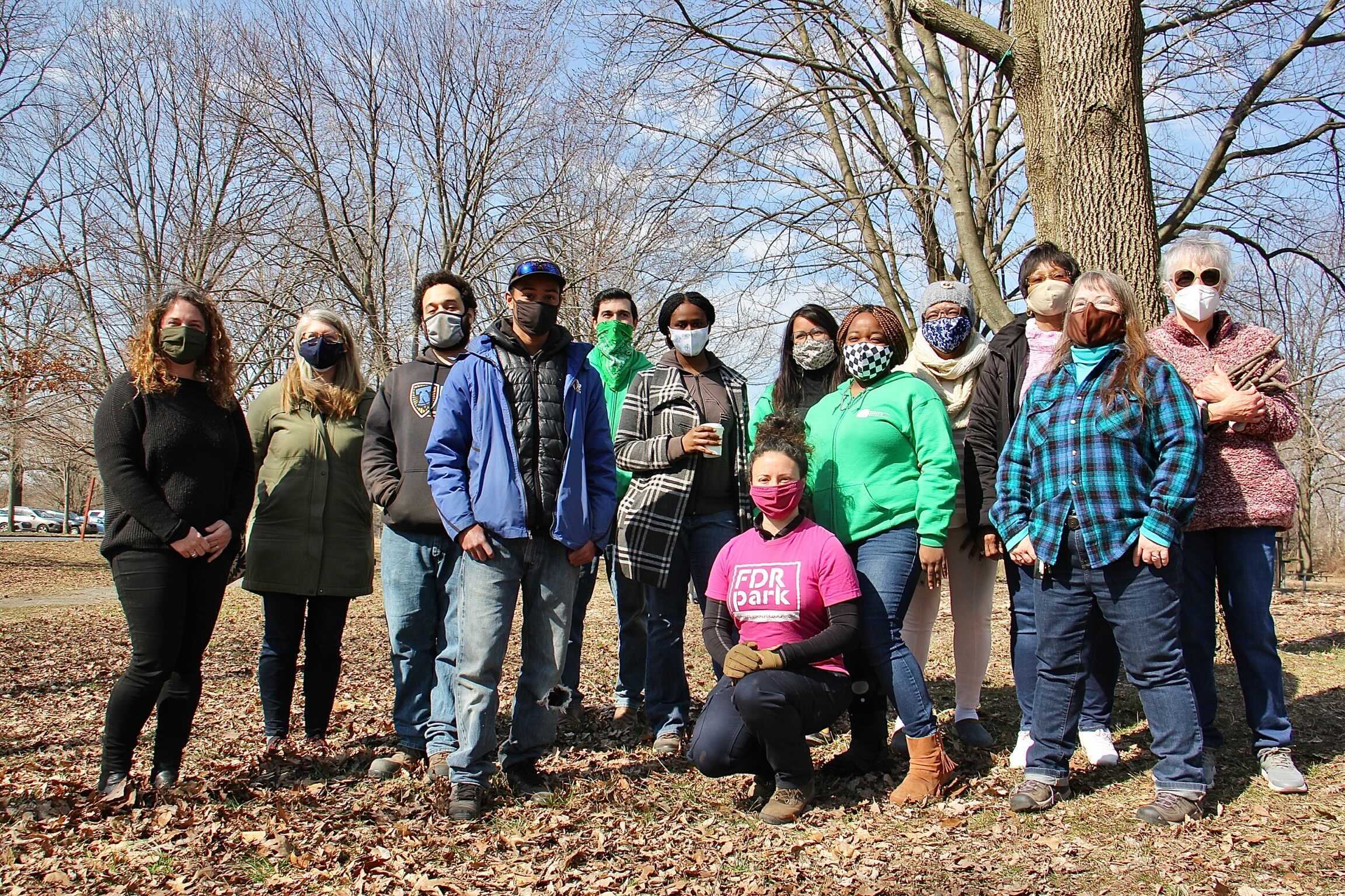 Volunteers stand in a line at FDR Park