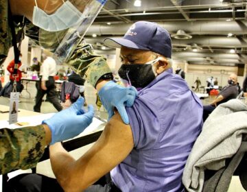 Garry Deans is vaccinated at FEMA's coronavirus vaccination center