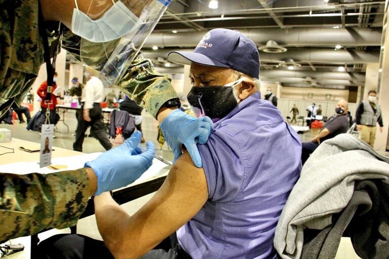 Garry Deans is vaccinated at FEMA's coronavirus vaccination center