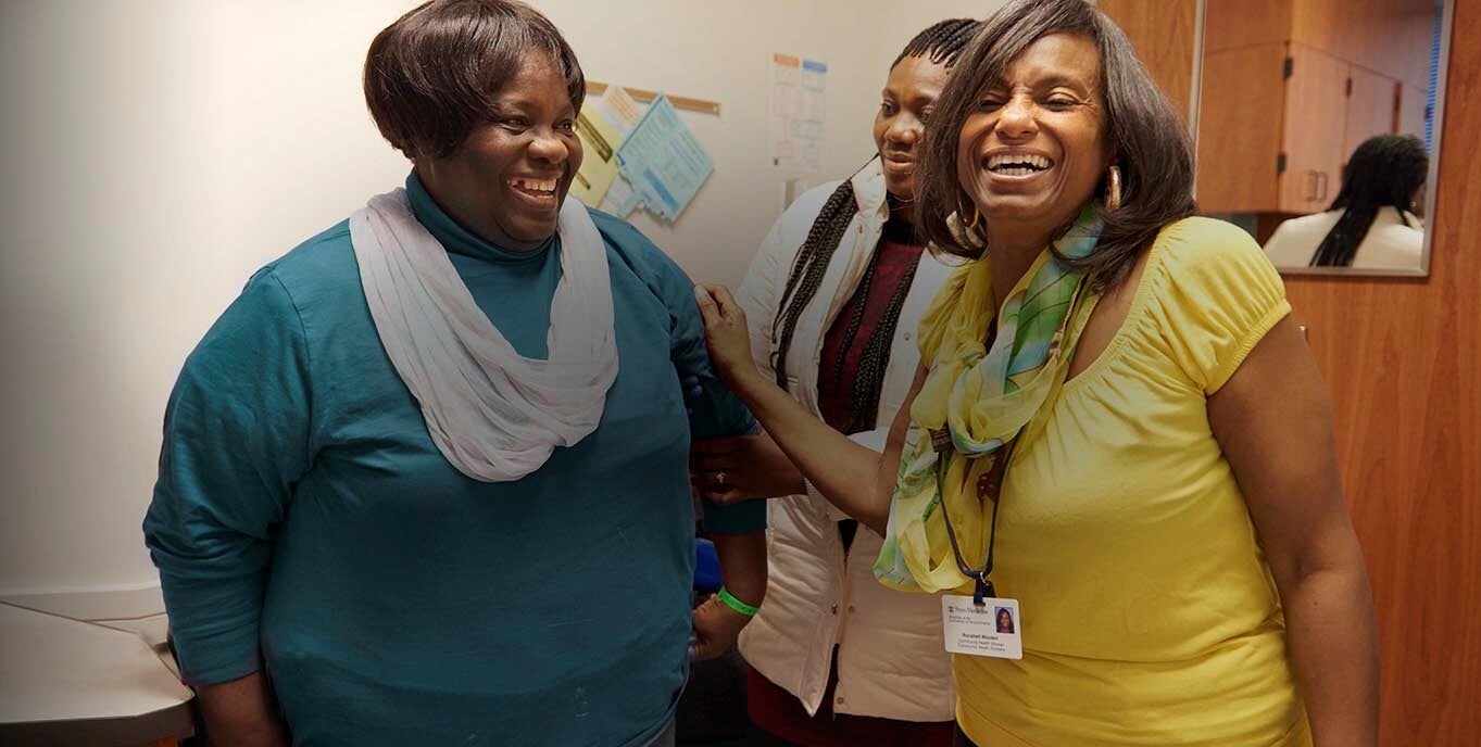 Philadelphia Community health worker Rocshell Wooten (far-right) accompanies patient Grace Ikpe to their primary care appointment